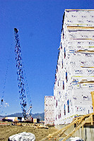 Pre-fab crane assembly stage on commercial housing building