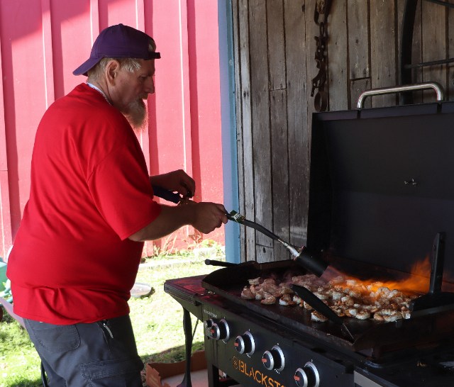 Kirk Dickinson torching the #15 shrimp and prime rib.