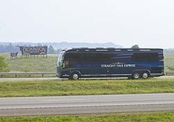 Sarah Palin and John McCain on campaign bus looking at ranch billboard